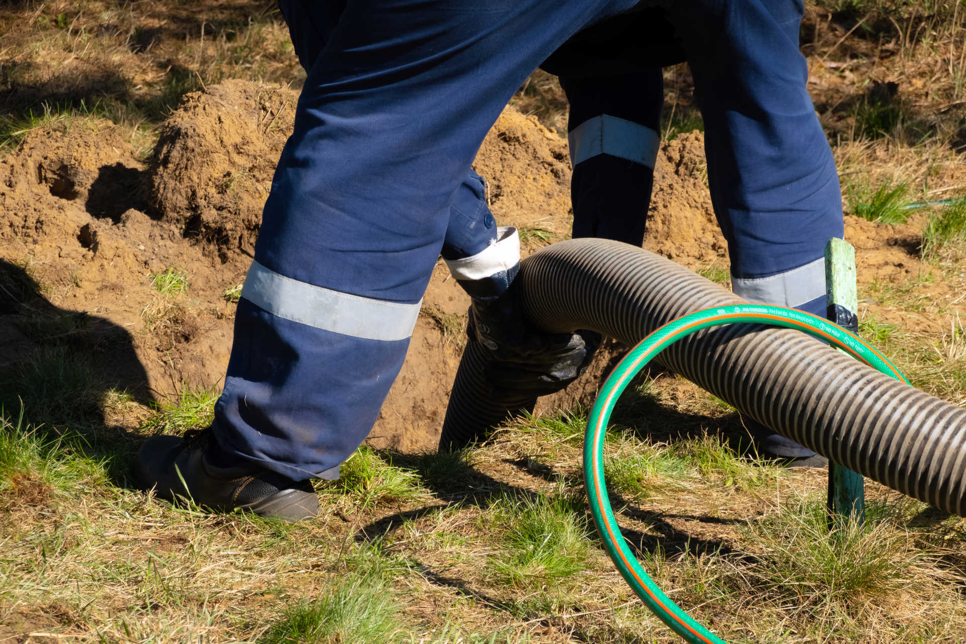 Septic system professional draining septic tank when it is full