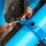 Replace or repair broken drainpipe – A man repairing a drain pipe